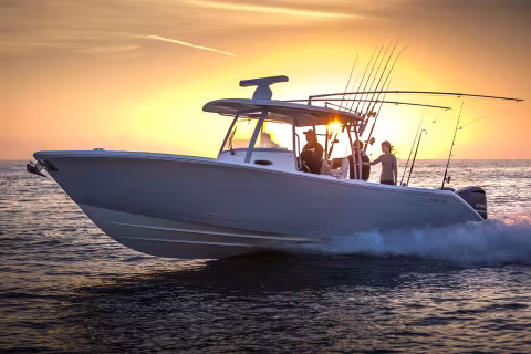 boat in front of sunset