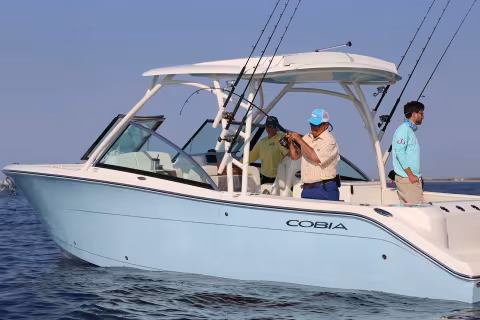 people fishing off boat