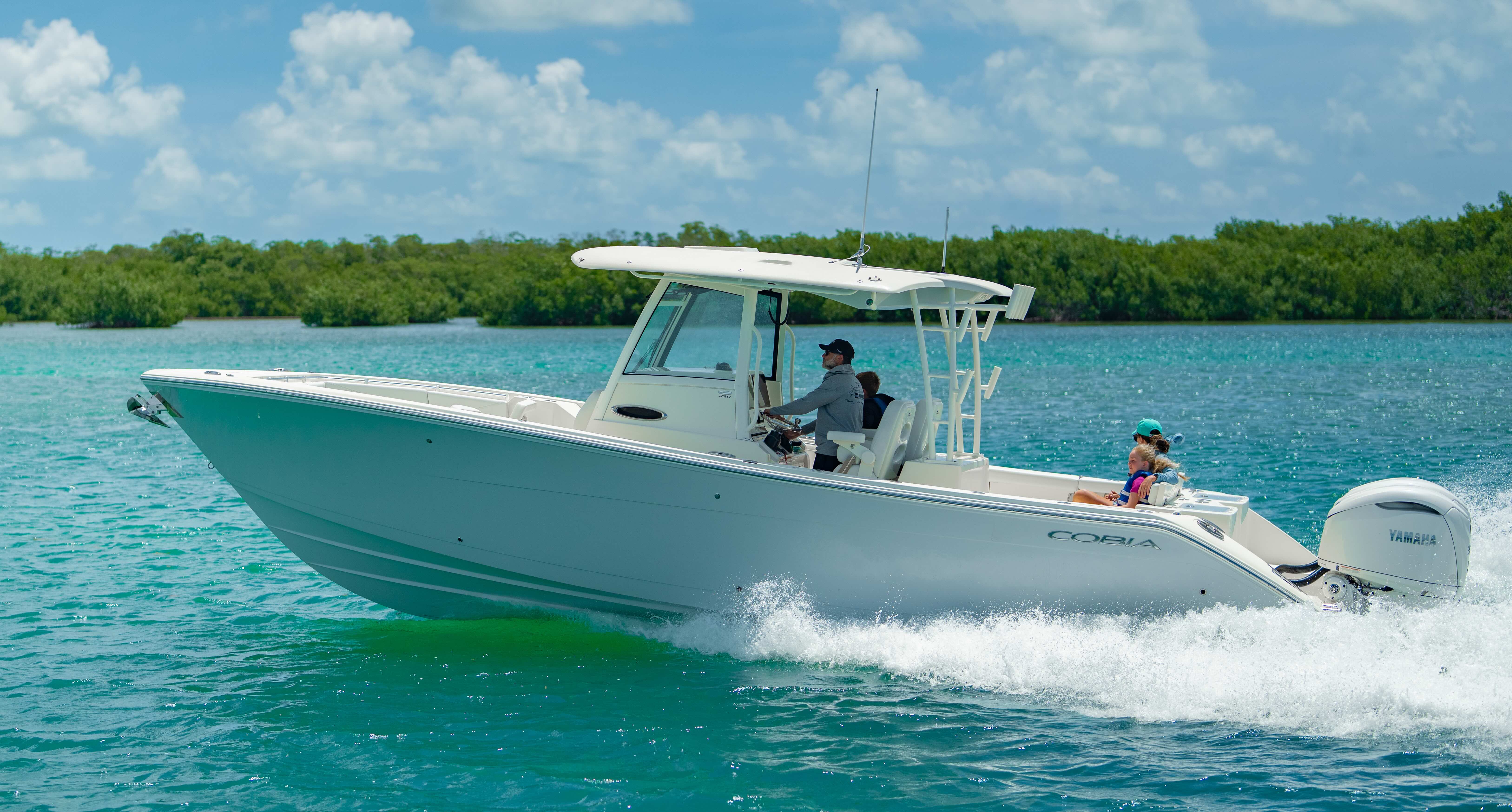 From the large hardtop to the fold-away aft seating and convenient dive door, every detail is designed to enhance your day on the water. Whether you're entertaining at the sandbar or on your way back from a day offshore, comfort comes naturally aboard the 320 CC. 
