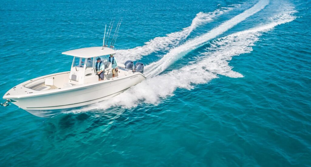 Cobia 280 Center Console with twin engines running.